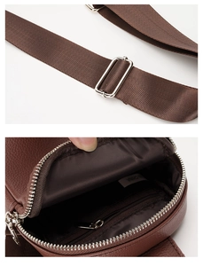 Detail of adjustable woven strap and interior compartment of men's brown leather chest bag