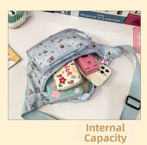 Internal capacity view of light blue dachshund print crossbody bag showing spacious storage