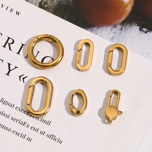 Detailed view of assorted geometric 18K gold plated stainless steel spring clasp charms