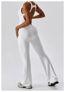 Detailed back view of white backless flare yoga bodysuit with high-stretch fabric fit