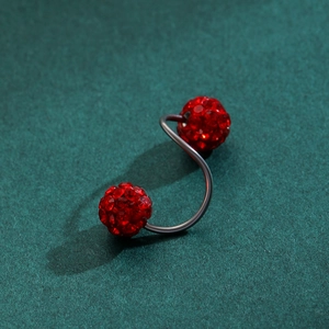 Detailed view of red pavé disco ball belly ring with S-curve stainless steel bar
