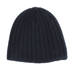 Close-up of dark blue ribbed knit beanie showing high-quality warmth-retaining texture