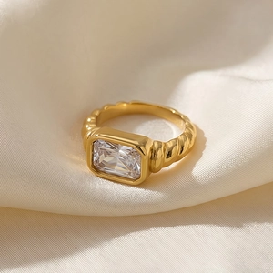 French style gold twisted croissant ring with rectangular clear zircon stone