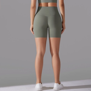 Detail of high-waist seamless yoga shorts showing breathable fabric and grey-green texture