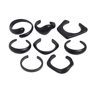 Matte black irregular geometric open bracelet and rings set in minimalist aesthetic