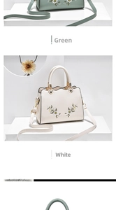 Detail of floral embroidery and heart-shaped metal buckles on green and white handbags