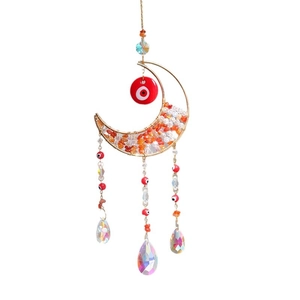 Moon suncatcher with orange crystals, evil eye bead, and rainbow crystal pendant