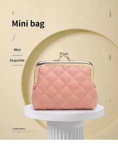 Detail der rosa gesteppten PU-Leder Geldbörse mit goldenem Retro-Kugelverschluss