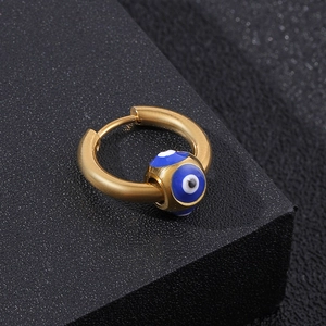 Detailed view of a gold stainless steel hoop earring with a blue and white evil eye bead