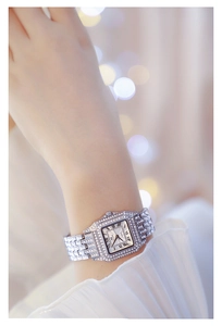 Close-up of luxury square quartz watch with Roman numerals and full crystal inlay
