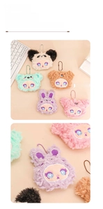 Close-up of colorful plush creature pendants with detailed facial embroidery and bead chains