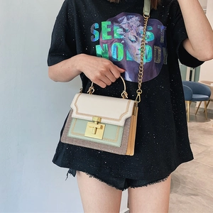Fashionable color-block crossbody bag with metal chain strap and top handle design