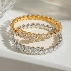 Luxurious stainless steel bangles with sparkling white zircons in gold and silver finishes