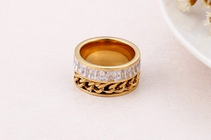 Detail of gold rotatable chain ring featuring square zircons and Cuban link texture