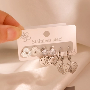 Three pairs of stainless steel heart earrings including studs and hoops set for women