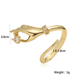 Chic 18K gold plated hand-shaped ring with sparkling cubic zirconia on white background