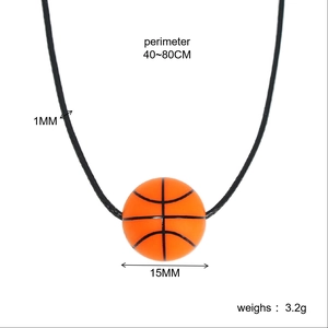 Detailed view of the 15mm orange basketball pendant with adjustable black cord length
