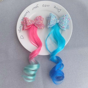 Kids gradient hair extensions with sequin bows in pink and blue for festive hairstyles