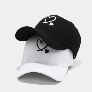 Minimalist baseball caps with heart embroidery in black and white colors for couples