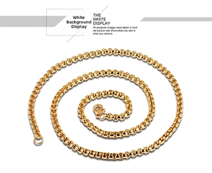Detailed view of polished gold box chain necklace with secure lobster clasp closure