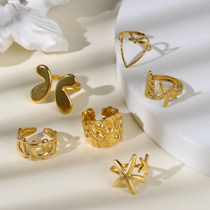 Set of vintage 18k gold plated stainless steel open rings with butterfly and shell designs