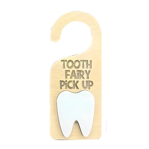 Detailed close-up of a wooden tooth fairy door hanger with white tooth icon and engraved text