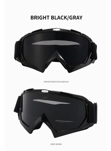 Front and side views of bright black ski goggles with dark gray lenses and wide elastic band
