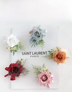 Detail of silk rose boutonnieres and wrist corsages in five elegant floral colors