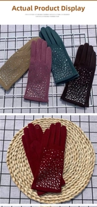 Detail of touchscreen embroidery and scattered rhinestones on fleece winter gloves