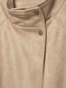 Close-up of khaki suede jacket collar with vintage metal buttons and fine stitching
