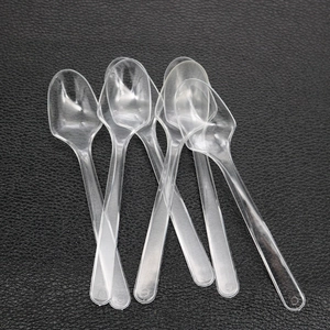 Close-up of disposable transparent plastic mixing spoons for DIY resin craft tools