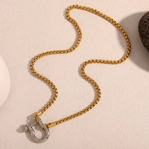 Elegant 18K gold plated box chain necklace with silver U-shaped clasp on stone base