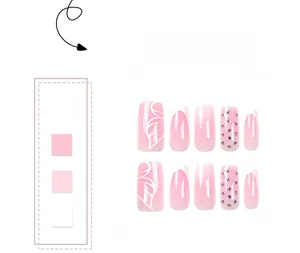Detailed view of pink gradient press-on nails with butterfly patterns and rhinestones