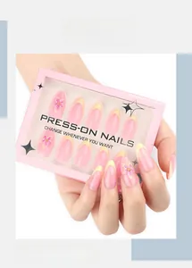 Détails de faux ongles amande avec fleurs 3D et bordures françaises jaunes élégantes