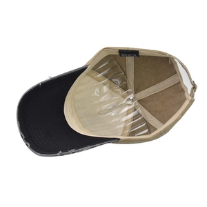 Detail view of cotton baseball cap interior showing the quality stitching and fabric label