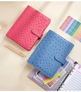 Detail of rose red and blue ostrich leather A5 notebook binder with magnetic buckle