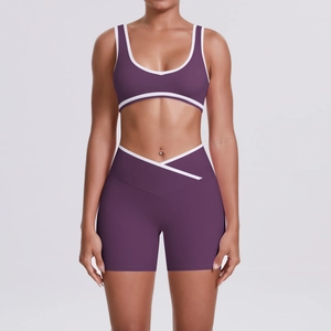 Detail of purple yoga set with white contrast piping and V-shape crossover waistband