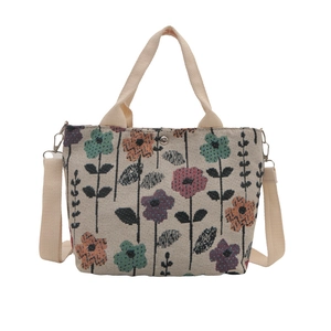 Minimalist canvas tote bag with floral pattern and detachable strap on white background