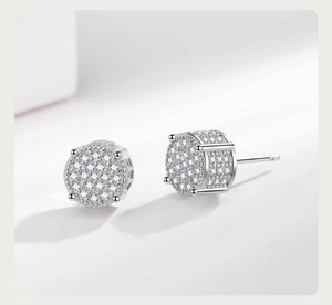 Macro detail of silver hip hop stud earrings featuring pave-set cubic zirconia crystals