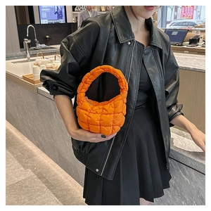 Trendy orange quilted cloud handbag for women chic puffer underarm bag stylish mini tote purse.