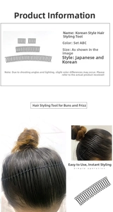 Close-up of black wavy metal hair finishing comb showing fine teeth and fit for loose hair
