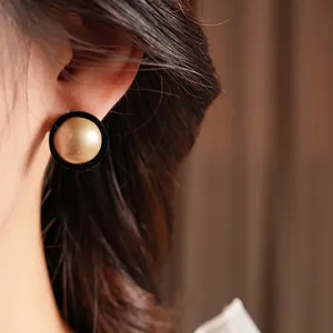 French vintage style earrings with champagne faux pearls and black velvet flocking design