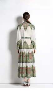 Back view of a long-sleeved floral maxi dress with three-layer tiered skirt and vintage print