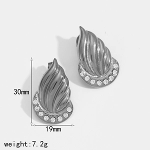 Detailed view of silver leaf flame earrings with rhinestones measuring 30mm by 19mm