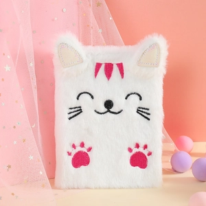 Close-up of white plush cat notebook featuring pink paw embroidery and 3D furry ears