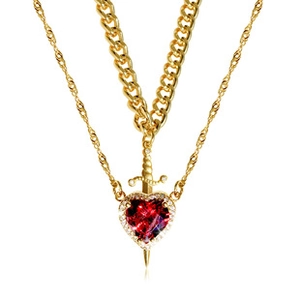 Close-up of gold layered chain necklace featuring a red heart stone and sword pendant