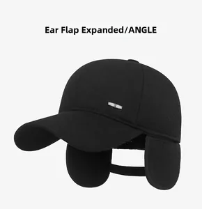 Detail view of unfolded ear flaps on a thick black winter baseball cap for men
