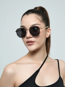 Detail of vintage rectangle metal sunglasses with gold frames on a female model