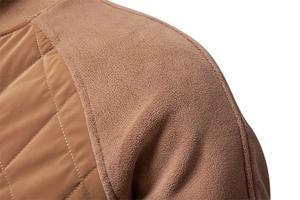 Detail of men's brown jacket showing quilted nylon and soft fleece fabric textures