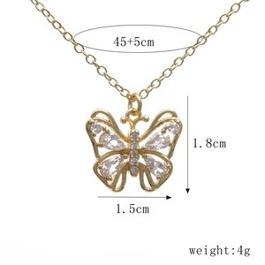 Detail view of hollow butterfly pendant necklace with dimensions 1.8cm by 1.5cm and 4g weight